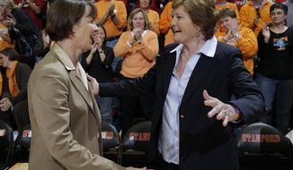 FILE - Stanford head coach Tara VanDerveer, left, and Tennessee head coach Pat Summitt, right, and greet each other before an NCAA college basketball game in Stanford, Calif., in this Tuesday, Dec. 20, 2011, file photo. Their mutual respect always showed, and shined. So, when VanDerveer tied the late Hall of Famer as winningest women&#39;s coaches in history with 1,098 victories Sunday night, Dec. 13, 2020, she quickly credited Summitt for helping her get there. (AP Photo/Paul Sakuma, File)