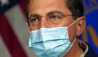 Then-Health and Human Services Secretary Alex Azar speaks at George Washington University Hospital, Monday, Dec. 14, 2020, in Washington, before watching COVID-19 vaccines being administered to hospital workers. (AP Photo/Jacquelyn Martin, Pool) ** FILE **