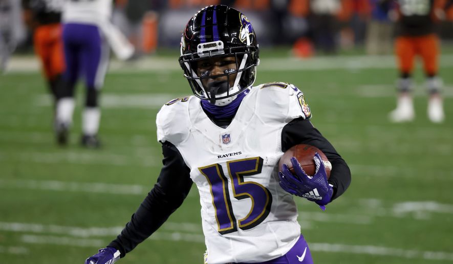 Baltimore Ravens wide receiver Marquise Brown (15) runs with the ball during an NFL football game against the Cleveland Browns, Monday, Dec. 14, 2020, in Cleveland. (AP Photo/Kirk Irwin)  **FiLE**