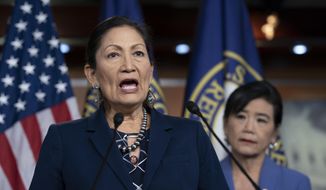 In this March 5, 2020, photo Rep. Deb Haaland, D-N.M., Native American Caucus co-chair, joined at right by Rep. Judy Chu, D-Calif., chair of the Congressional Asian Pacific American Caucus, speaks to reporters about the 2020 Census on Capitol Hill in Washington. (AP Photo/J. Scott Applewhite) **FILE**