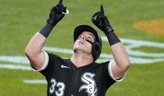 FILE - In this Sept. 9, 2020, file photo, Chicago White Sox&#x27;s James McCann (33) celebrates as he crosses home plate after hitting a solo home run off Pittsburgh Pirates starting pitcher JT Brubaker during the third inning of a baseball game in Pittsburgh. Free agent catcher James McCann and the New York Mets were close to completing a $40 million, four-year contract Saturday, Dec. 12, 2020, as the team continues to upgrade its roster under new owner Steve Cohen. A person close to the deal confirmed the details to The Associated Press under condition of anonymity because there was no official announcement. (AP Photo/Gene J. Puskar, File)