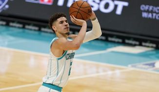 Charlotte Hornets guard LaMelo Ball shoots against the Toronto Raptors during the second half of an NBA preseason basketball game in Charlotte, N.C., on Saturday, Dec. 12, 2020. (AP Photo/Chris Carlson)