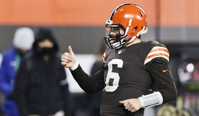Cleveland Browns quarterback Baker Mayfield celebrates a 21-yard touchdown pass to wide receiver Rashard Higgins during the second half of an NFL football game against the Baltimore Ravens, Monday, Dec. 14, 2020, in Cleveland. (AP Photo/Ron Schwane)