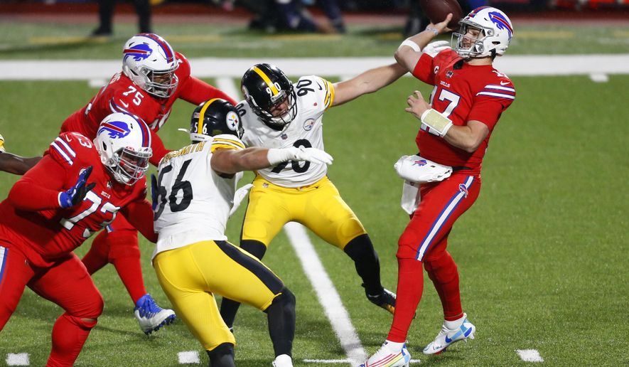 Buffalo Bills quarterback Josh Allen (17) gets off a pass under pressure from Pittsburgh Steelers outside linebacker T.J. Watt (90) during the first half of an NFL football game in Orchard Park, N.Y., Sunday, Dec. 13, 2020. The Bills won 26-15. (AP Photo/Jeffrey T. Barnes )