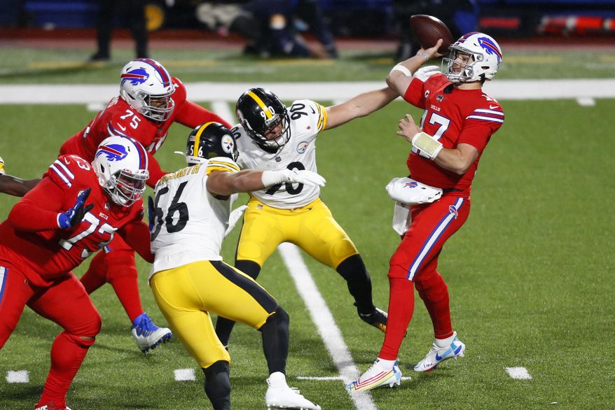 Buffalo Bills quarterback Josh Allen (17) gets off a pass under pressure from Pittsburgh Steelers outside linebacker T.J. Watt (90) during the first half of an NFL football game in Orchard Park, N.Y., Sunday, Dec. 13, 2020. The Bills won 26-15. (AP Photo/Jeffrey T. Barnes )