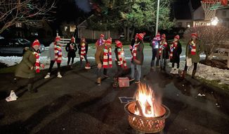 Members of the COVID Carolers sing songs in Framingham, Massachusetts, on Dec. 11. The ensemble convened for outdoor rehearsals this fall and has kept a steady weekend schedule performing this season. (Photos courtesy of Lisa Deveau)