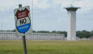 In this Aug. 28, 2020, photo, a &quot;no trespassing&quot; sign is displayed outside the federal prison complex in Terre Haute, Ind. A newly released report says the U.S. government for the first time has carried out more civil executions in a year than all states combined as President Donald Trump oversaw a resumption of federal executions after a 17-year pause. (AP Photo/Michael Conroy) **FILE**