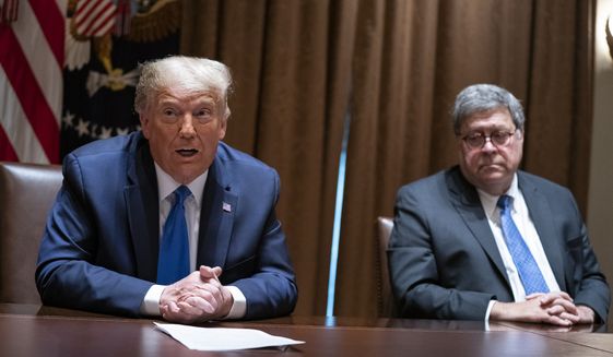 In this Sept. 23, 2020, file photo, then-Attorney General William P. Barr listens as President Donald Trump speaks during a meeting with Republican state attorneys general about social media companies, in the Cabinet Room of the White House in Washington. (AP Photo/Evan Vucci, File)