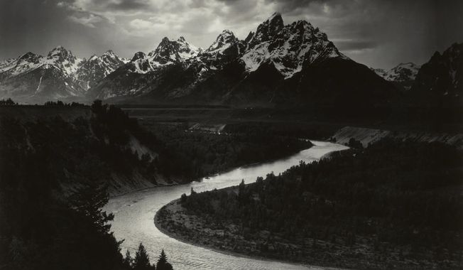 This 1942 Ansel Adams photo provided by Sotheby&#x27;s and The Ansel Adams Publishing Rights Trust shows, a West Texas oilman&#x27;s mural-sized print of Ansel Adams&#x27; photo, &amp;quot;The Grand Tetons and the Snake River, Grand Teton National Park, Wyoming.&amp;quot; Sotheby&#x27;s New York, the auction house, said Tuesday, Dec. 15, 2020, that the print sold for $988,000, a record price for Adams at auction. (Ansel Adams/The Ansel Adams Publishing Rights Trust/Sotheby&#x27;s via AP)