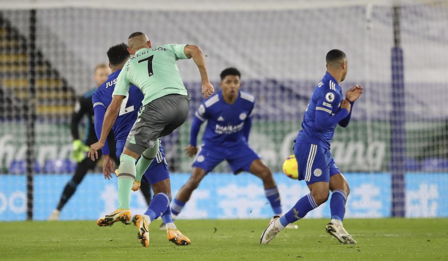 Everton&#x27;s Richarlison scores his side&#x27;s opening goal during the English Premier League soccer match between Leicester City and Everton at the King Power Stadium in Leicester, England, Wednesday, Dec. 16, 2020. (Nick Potts/Pool via AP)