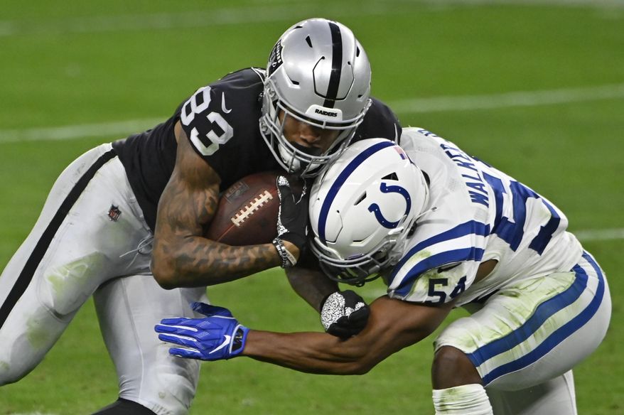 Indianapolis Colts middle linebacker Anthony Walker (54) tackles Las Vegas Raiders tight end Darren Waller (83) during the second half of an NFL football game, Sunday, Dec. 13, 2020, in Las Vegas. (AP Photo/David Becker)