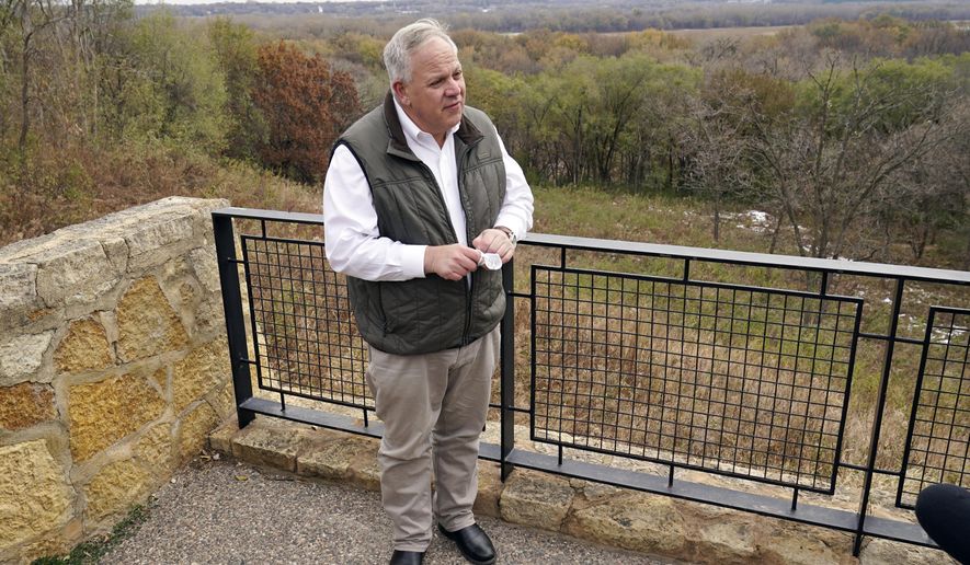 Interior Secretary David Bernhardt takes reporters' questions overlooking the Minnesota River area after he announced the gray wolf's recovery "a milestone of success during a stop at the Minnesota Valley National Wildlife Refuge, Thursday, Oct. 29, 2020, in Bloomington, Minn. The move stripped Endangered Species Act protections for gray wolves in most of the U.S., ending longstanding federal safeguards and putting states and tribes in charge of overseeing the predators. (AP Photo/Jim Mone)