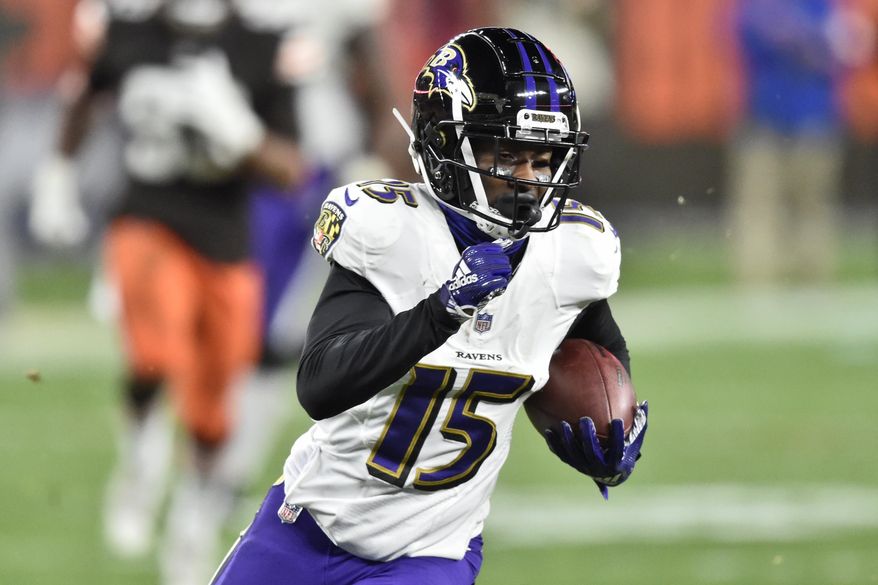 Baltimore Ravens wide receiver Marquise Brown (15) runs after catching a pass for a 44-yard touchdown during the second half of an NFL football game against the Cleveland Browns, Monday, Dec. 14, 2020, in Cleveland. The Ravens won 47-42. (AP Photo/David Richard)