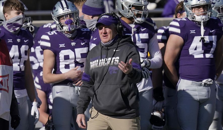 Kansas State head coach Chris Klieman directs his team during the first half of an NCAA college football game against Texas in Manhattan, Kan., Saturday, Dec. 5, 2020. (AP Photo/Orlin Wagner)