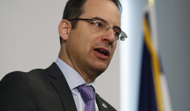 CORRECTS TO A GROUP OF 35 STATES AS WELL AS THE DISTRICT OF COLUMBIA AND TERRITORIES OF GUAM AND PUERTO RICO FILED, INSTEAD OF 38 STATES  FILE - In this Oct. 7, 2019, file photo, Colorado Attorney General Phil Weiser speaks during a news conference in Denver. A group of 35 states as well as the District of Columbia and the territories of Guam and Puerto Rico filed an anti-trust lawsuit against Google on Thursday, Dec. 17, 2020, alleging that the search giant has an illegal monopoly over the online search market that hurts consumers and advertisers. The lawsuit, announced by Weiser, was filed in federal court in Washington, D.C. by states represented by bipartisan attorneys general. (AP Photo/David Zalubowski, File)