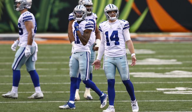 Dallas Cowboys quarterback Andy Dalton (14) reacts to an intentional grounding call in the second half of an NFL football game against the Cincinnati Bengals in Cincinnati, Sunday, Dec. 13, 2020. (AP Photo/Aaron Doster)