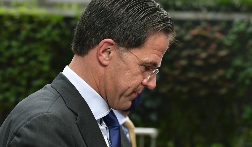 FILE In this Sunday, July 19, 2020 file photo, Netherlands' Prime Minister Mark Rutte arrives for an EU summit at the European Council building in Brussels. A Dutch parliamentary commission issued a damning report Thursday, Dec. 17, 2020 into a scandal in which thousands of parents were wrongly labeled fraudsters by government officials assessing claims for child benefit payments. The report titled “Unprecedented Injustice” was issued following an investigation by a parliamentary committee and public questioning of officials up to and including Prime Minister Mark Rutte into the scandal. (John Thys, Pool Photo via AP, File)