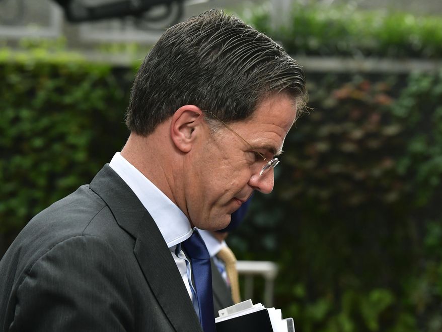 FILE In this Sunday, July 19, 2020 file photo, Netherlands' Prime Minister Mark Rutte arrives for an EU summit at the European Council building in Brussels. A Dutch parliamentary commission issued a damning report Thursday, Dec. 17, 2020 into a scandal in which thousands of parents were wrongly labeled fraudsters by government officials assessing claims for child benefit payments. The report titled “Unprecedented Injustice” was issued following an investigation by a parliamentary committee and public questioning of officials up to and including Prime Minister Mark Rutte into the scandal. (John Thys, Pool Photo via AP, File)