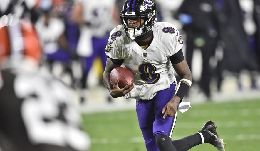 Baltimore Ravens quarterback Lamar Jackson (8) rushes for a 17-yard touchdown during the first half of an NFL football game against the Cleveland Browns, Monday, Dec. 14, 2020, in Cleveland. (AP Photo/David Richard)