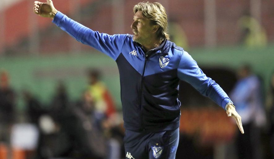 FILE - In this Feb. 18, 2020, file photo, Velez Sarsfield coach Gabriel Heinze directs his players during a Copa Sudamericana soccer match against Aucas at the Gonzalo Pozo Ripalda stadium in Quito, Ecuador. Hoping to recreate the success of its first coach, Atlanta United hired Argentina's Gabriel Heinze on Friday, Dec. 18, 2020, to manage the Five Stripes, who endured a miserable season just two years after winning the MLS Cup championship. (AP Photo/Dolores Ochoa, File)