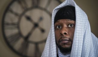Myon Burrell is photographed at his home in Minneapolis, Thursday, Dec. 17, 2020, two days after his release from prison. Minnesota&#39;s pardon board on Tuesday commuted the sentence of Burrell, 34, who was sent to prison for life as a teen in a high-profile murder case that raised questions about the integrity of the criminal justice system. (AP Photo/John Minchillo)