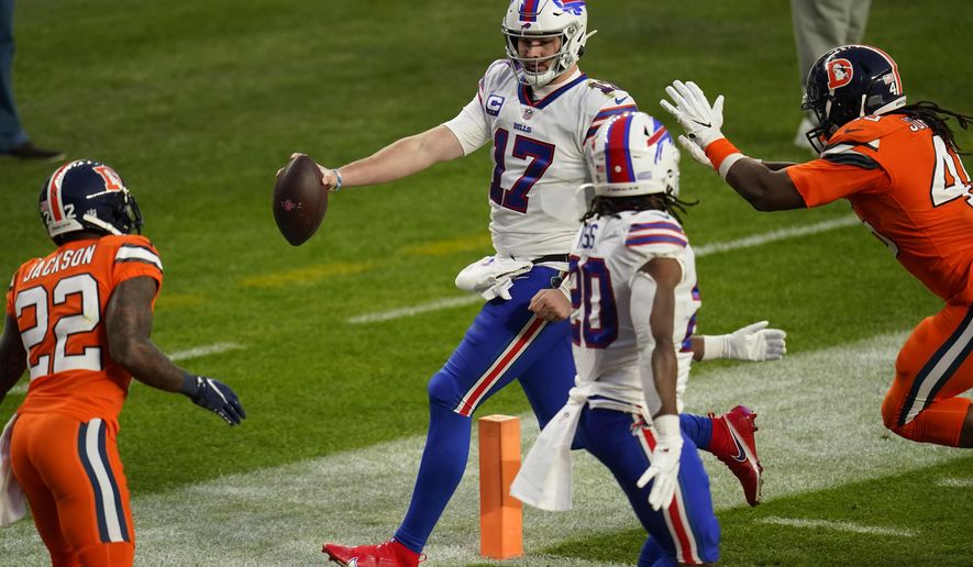 Buffalo Bills quarterback Josh Allen scores a touchdown during the second half of an NFL football game against the Denver Broncos, Saturday, Dec. 19, 2020, in Denver. (AP Photo/Jack Dempsey)