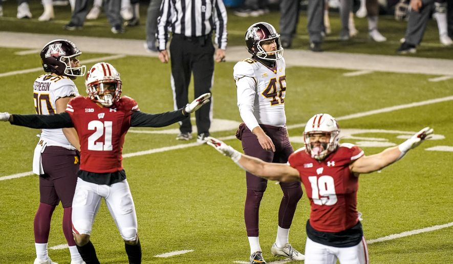 Minnesota kicker Andres Gelecinskyj (48) reacts after his field goal attempt failed during overtime of an NCAA college football game against Wisconsin, Saturday, Dec. 19, 2020, in Madison, Wis. (AP Photo/Andy Manis)