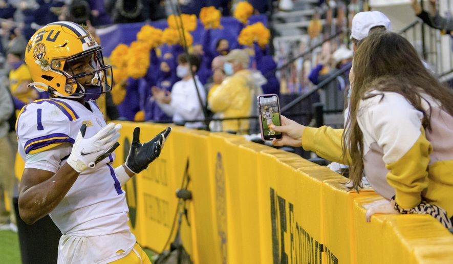 LSU wide receiver Kayshon Boutte (1) reacts after making a touchdown against Mississippi during the first half of an NCAA college football game in Baton Rouge, La., Saturday, Dec. 19, 2020. (AP Photo/Matthew Hinton)
