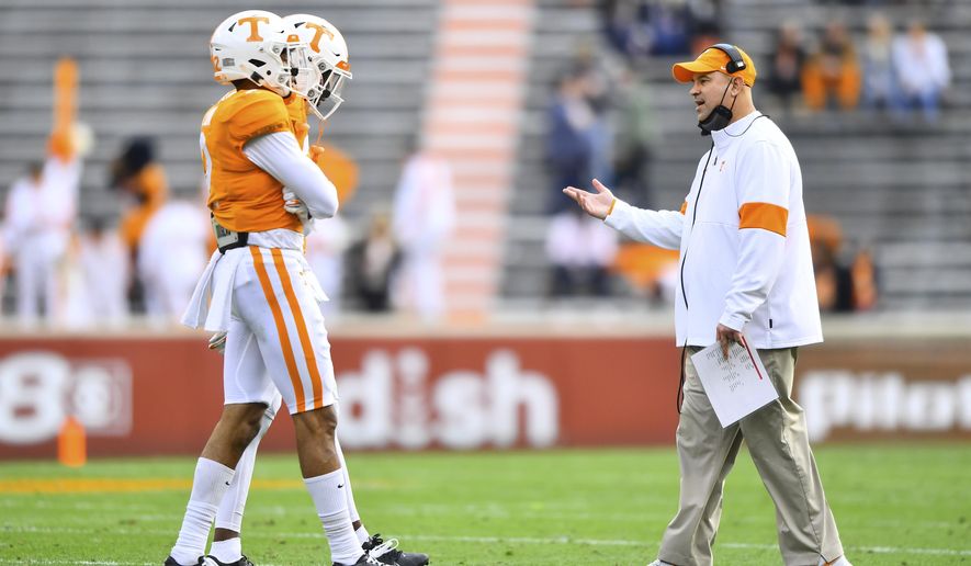 Tennessee head coach Jeremy Pruitt walks onto the field to talk to players during an NCAA college football game against Texas A&M in Neyland Stadium in Knoxville, Tenn., Saturday, Dec. 19, 2020. (Brianna Paciorka/Knoxville News Sentinel via AP, Pool)