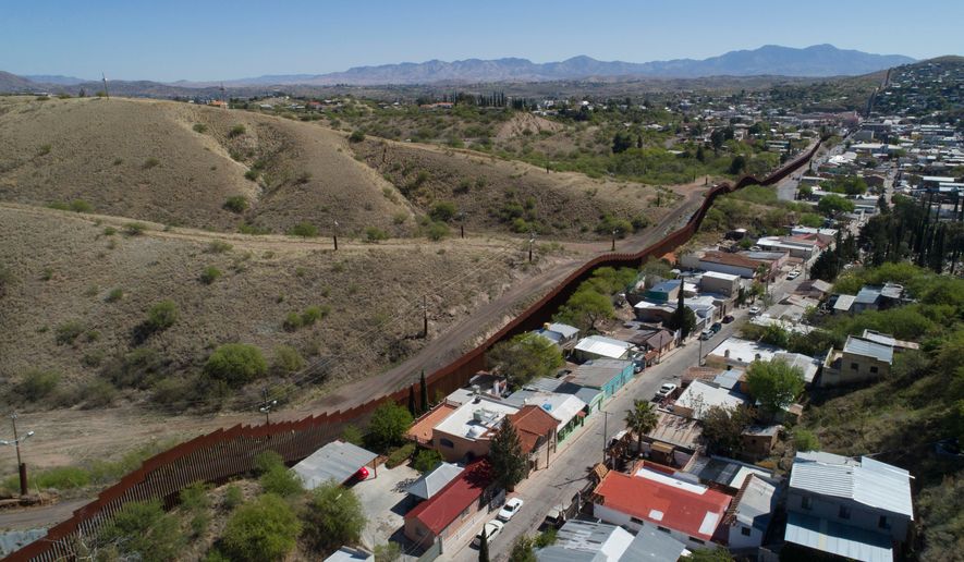 U.S. Mexico border fence as it cuts through the two downtowns of Nogales. (AP Photo/Brian Skoloff, File)