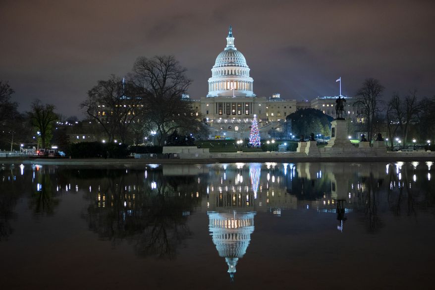 The U.S. Capitol is seen at night after negotiators sealed a deal for COVID relief, Sunday, Dec. 20, 2020, in Washington. Top Capitol Hill negotiators sealed a deal Sunday on an almost $1 trillion COVID-19 economic relief package, finally delivering long-overdue help to businesses and individuals and providing money to deliver vaccines to a nation eager for them. (AP Photo/Jose Luis Magana.