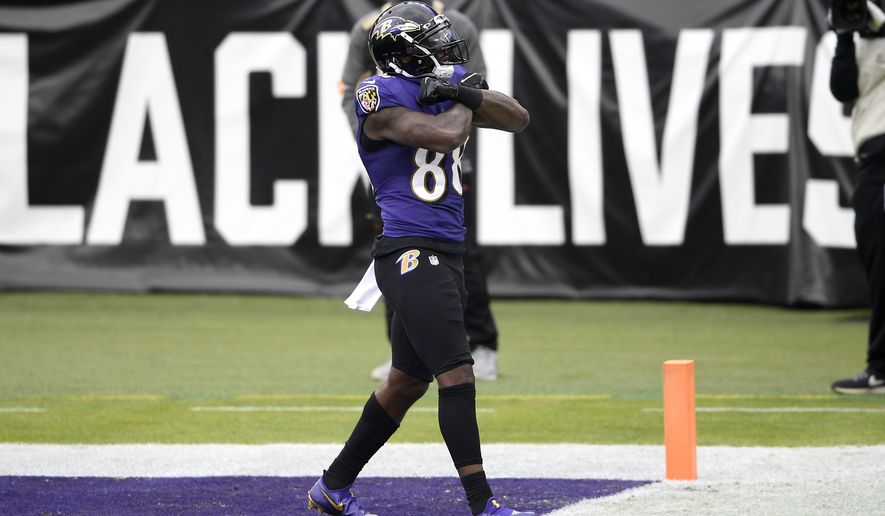Baltimore Ravens wide receiver Dez Bryant reacts after scoring a touchdown against the Jacksonville Jaguars during the first half of an NFL football game, Sunday, Dec. 20, 2020, in Baltimore. (AP Photo/Nick Wass)