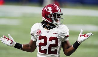 Alabama running back Najee Harris (22) reacts to his touchdown against Florida during the first half of the Southeastern Conference championship NCAA college football game, Saturday, Dec. 19, 2020, in Atlanta. (AP Photo/John Bazemore)