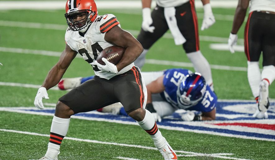 Cleveland Browns' Nick Chubb (24) rushes during the second half of an NFL football game against the New York Giants Sunday, Dec. 20, 2020, in East Rutherford, N.J. (AP Photo/Seth Wenig)