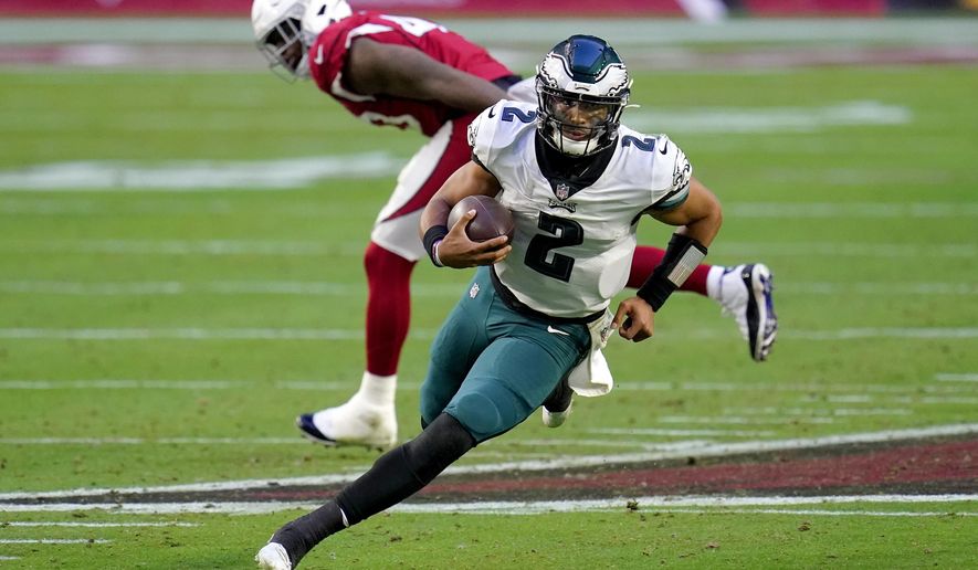 Philadelphia Eagles quarterback Jalen Hurts (2) scrambles against the Arizona Cardinals during the second half of an NFL football game, Sunday, Dec. 20, 2020, in Glendale, Ariz. (AP Photo/Ross D. Franklin)