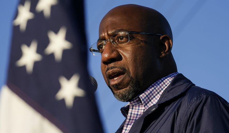 In this Nov. 15, 2020, file photo Raphael Warnock, a Democratic candidate for the U.S. Senate, speaks during a campaign rally in Marietta, Ga. As the head of the Atlanta church where Martin Luther King Jr. preached, Warnock has not shied away from impassioned sermons and forceful advocacy on behalf of the poor and disadvantaged. The 51-year-old now wants to take that progressive platform to the U.S. Senate. He is running to unseat one of Georgia&#x27;s Republican senators, Kelly Loeffler, in the Jan. 5 race.  (AP Photo/Brynn Anderson, File)