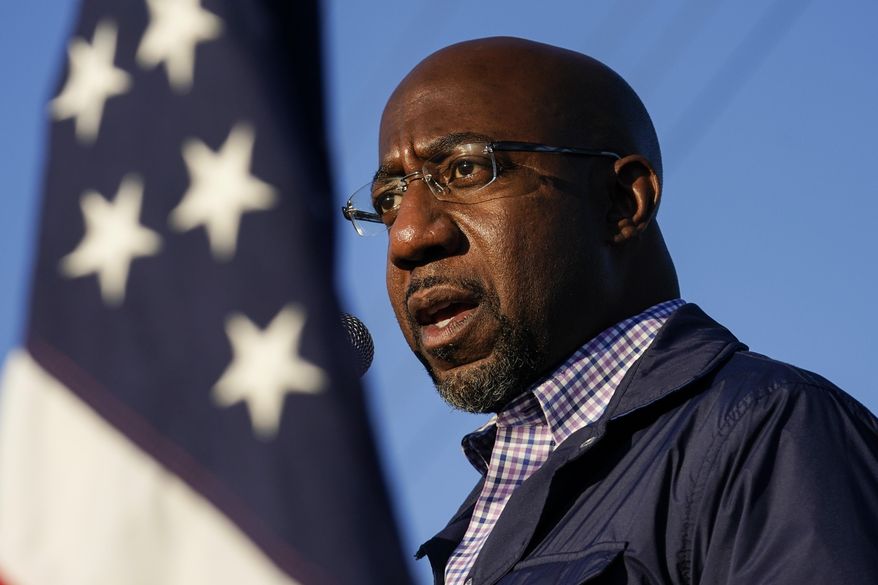 In this Nov. 15, 2020, file photo Raphael Warnock, a Democratic candidate for the U.S. Senate, speaks during a campaign rally in Marietta, Ga. As the head of the Atlanta church where Martin Luther King Jr. preached, Warnock has not shied away from impassioned sermons and forceful advocacy on behalf of the poor and disadvantaged. The 51-year-old now wants to take that progressive platform to the U.S. Senate. He is running to unseat one of Georgia&#39;s Republican senators, Kelly Loeffler, in the Jan. 5 race.  (AP Photo/Brynn Anderson, File)