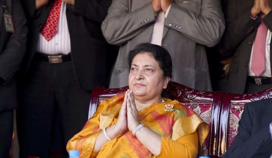 Nepali President Bidya Devi Bhandari pays respect during the opening ceremony of a traveling exhibition on Lumbini, Nepal in Yangon, Myanmar on Oct. 19, 2019. Nepal&#39;s president has dissolved Parliament after the prime minister made the recommendation amid an escalating feud within his Communist Party that is likely to push the Himalayan nation into a political crisis. Parliamentary elections will be held on April 30 and May 10, according to a statement from Bhandari&#39;s office. (AP Photo/Thein Zaw)