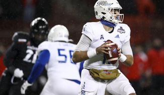 Tulsa quarterback Zach Smith looks to pass during the first half of the American Athletic Conference championship NCAA college football game against Cincinnati, Saturday, Dec. 19, 2020, in Cincinnati. (AP Photo/Aaron Doster)
