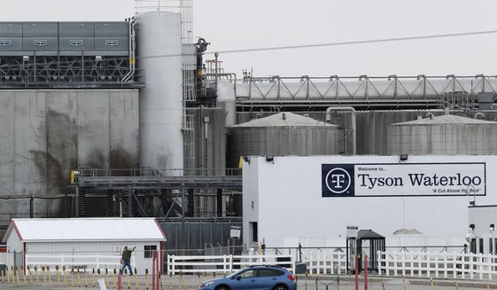 In this Friday, May 1, 2020, photo, a worker leaves the Tyson Foods plant in Waterloo, Iowa. The coronavirus devastated the nation&#39;s meatpacking communities in Iowa, Nebraska, and Minnesota earlier in the year.  (AP Photo/Charlie Neibergall, File)  **FILE**