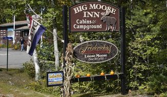 FILE—A sign for the Big Moose Inn is seen Friday, Sept. 18, 2020, near Millinocket, Maine. The inn was the setting for an Aug. 7 wedding reception that has since been linked to numerous cases of the coronavirus, and several deaths. Plans for a lawsuit against the Maine venue that hosted what became a &amp;quot;super spreader&amp;quot; wedding reception underscore the liability risks to small businesses amid the coronavirus pandemic and an uphill push by Republicans in Congress to give such outfits legal immunity. (AP Photo/Robert F. Bukaty, File)