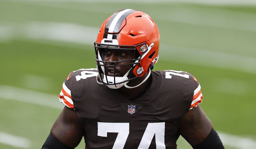 FILE - In this Oct. 11, 2020, file photo, Cleveland Browns offensive tackle Chris Hubbard (74) warms up before an NFL football game against the Indianapolis Colts in Cleveland. Versatile offensive lineman Hubbard's season is likely over after he suffered a serious knee injury early in a win over the New York Giants on Sunday, Dec. 20, 2020. (AP Photo/Ron Schwane, File)