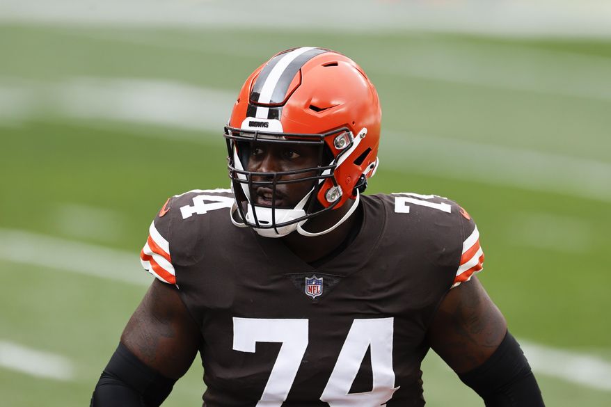 FILE - In this Oct. 11, 2020, file photo, Cleveland Browns offensive tackle Chris Hubbard (74) warms up before an NFL football game against the Indianapolis Colts in Cleveland. Versatile offensive lineman Hubbard's season is likely over after he suffered a serious knee injury early in a win over the New York Giants on Sunday, Dec. 20, 2020. (AP Photo/Ron Schwane, File)