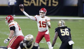 Kansas City Chiefs quarterback Patrick Mahomes (15) passes in the first half of an NFL football game against the New Orleans Saints in New Orleans, Sunday, Dec. 20, 2020. (AP Photo/Butch Dill)