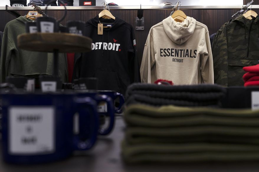 Clothing by local Detroit designers are displayed at Dose Collective, on Nov. 17, 2020, in Detroit, a new shop on Woodward Ave., where small shops can rent space for pop-ups. Tee Chapel is the owner of the space and it's her second location. (Antranik Tavitian/Detroit Free Press via AP)