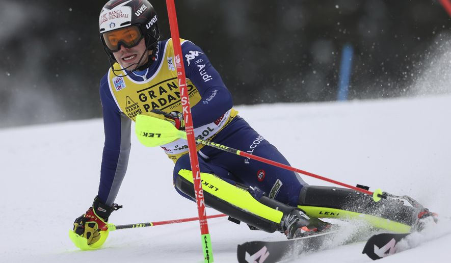 Italy's Alex Vinatzer speeds down the course during an alpine ski, men's World Cup slalom in Alta Badia, Italy, Monday, Dec.21, 2020. (AP Photo/AlessandroTrovati)
