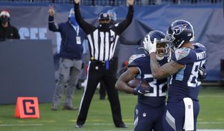 Tennessee Titans running back Darrynton Evans celebrates after scoring with tight end MyCole Pruitt during the second half of an NFL football game against the Detroit Lions Sunday, Dec. 20, 2020, in Nashville, N.C. (AP Photo/Ben Margot)