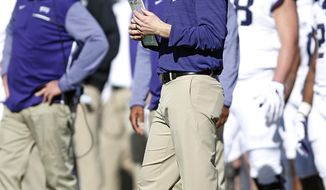 FILE - In this Saturday, Nov. 18, 2017, file photo, TCU offensive coordinator Sonny Cumbie waits for the time out during the second half of the NCAA college football game against Texas Tech, in Lubbock, Texas. In a move announced Monday, Dec. 21, 2020, former Texas Tech quarterback and assistant coach Cumbie is returning to the Red Raiders as their new offensive coordinator after the last seven seasons on TCU&#x27;s staff. (AP Photo/Brad Tollefson, File)