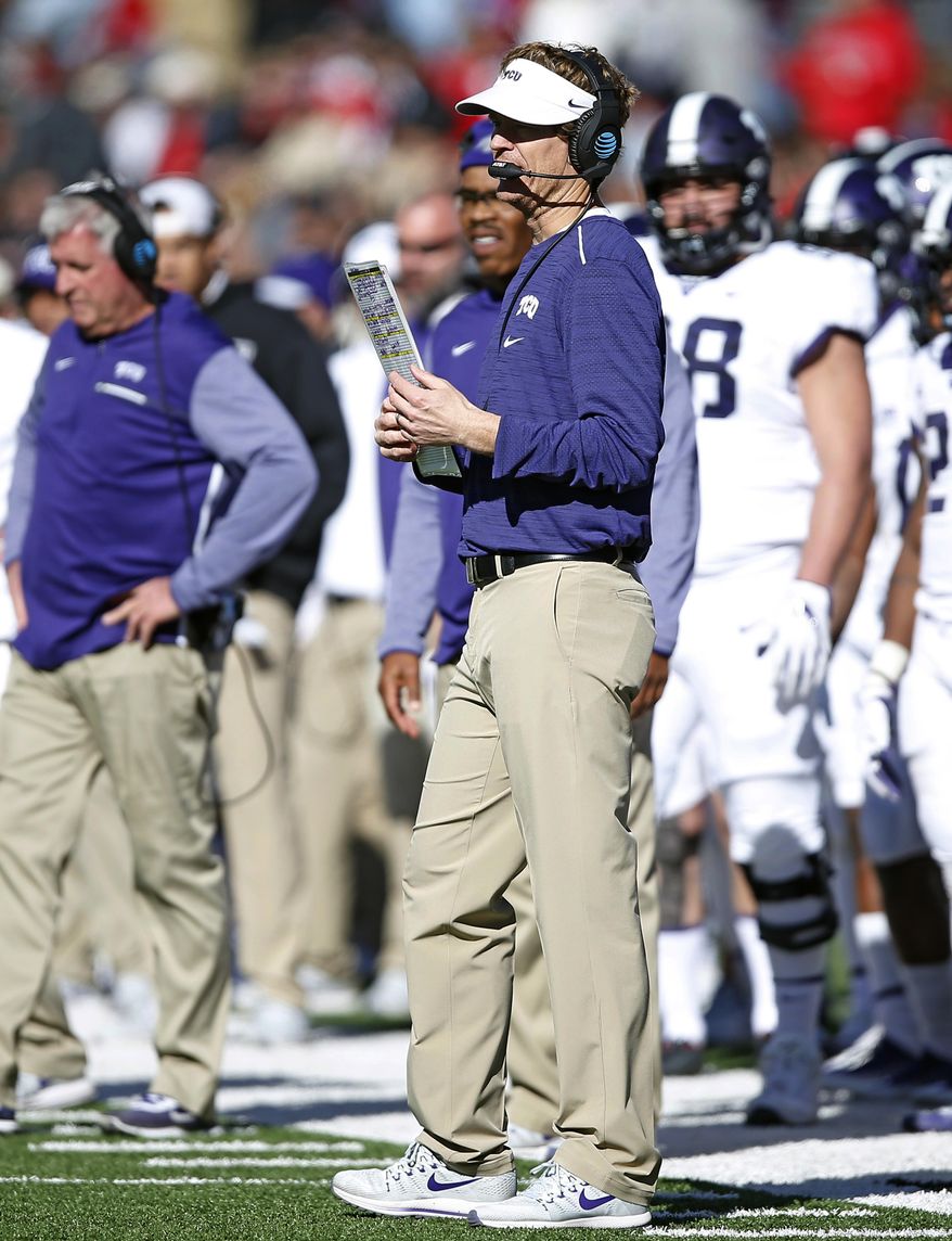 FILE - In this Saturday, Nov. 18, 2017, file photo, TCU offensive coordinator Sonny Cumbie waits for the time out during the second half of the NCAA college football game against Texas Tech, in Lubbock, Texas. In a move announced Monday, Dec. 21, 2020, former Texas Tech quarterback and assistant coach Cumbie is returning to the Red Raiders as their new offensive coordinator after the last seven seasons on TCU&#39;s staff. (AP Photo/Brad Tollefson, File)