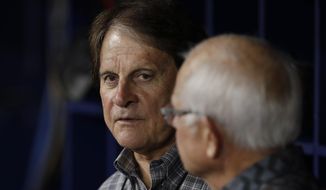 FILE - In this April 19, 2019, file photo, Tony La Russa, left, talks before a baseball game between the Tampa Bay Rays and the Boston Red Sox in St. Petersburg, Fla. La Russa, now the manager of the Chicago White Sox, is scheduled to change his plea to misdemeanor charges stemming from his drunken driving arrest nine months ago on a freeway in Phoenix. The Hall of Fame manager, who had previously pleaded not guilty to the two drunken driving charges, is scheduled to change his plea on Dec. 21 in Maricopa County Justice Court. (AP Photo/Chris O&#39;Meara, File)